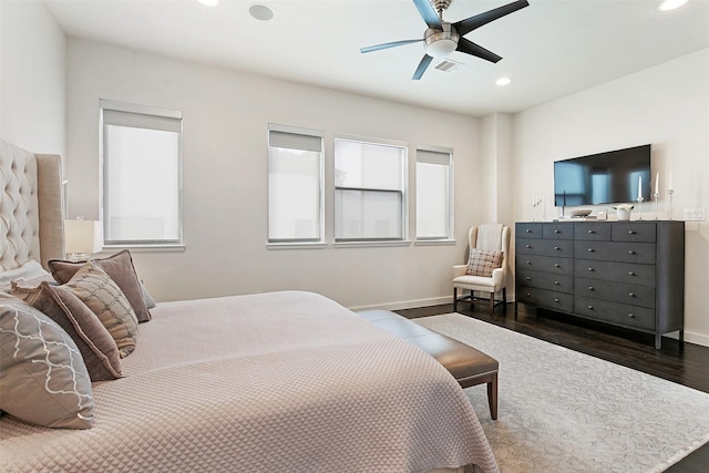 bedroom with dark wood-style floors, baseboards, visible vents, and recessed lighting