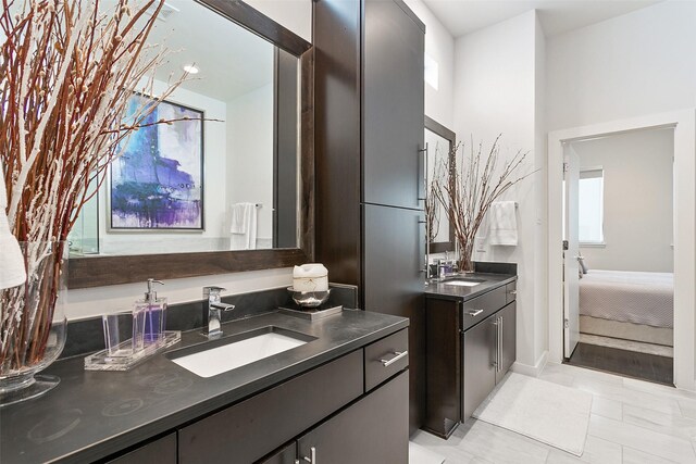 bathroom with tile patterned floors and vanity