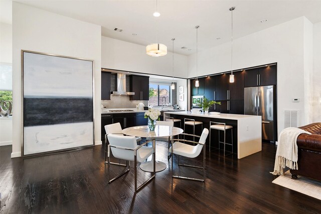 dining area with dark hardwood / wood-style flooring and sink