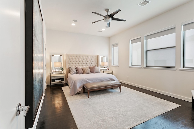 bedroom featuring ceiling fan and dark hardwood / wood-style floors