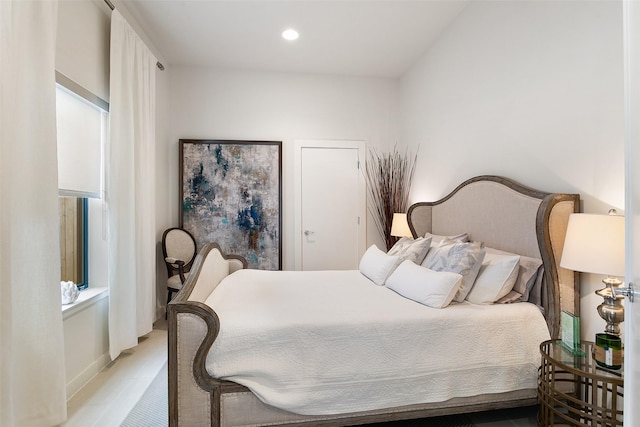 bedroom featuring light wood finished floors and recessed lighting