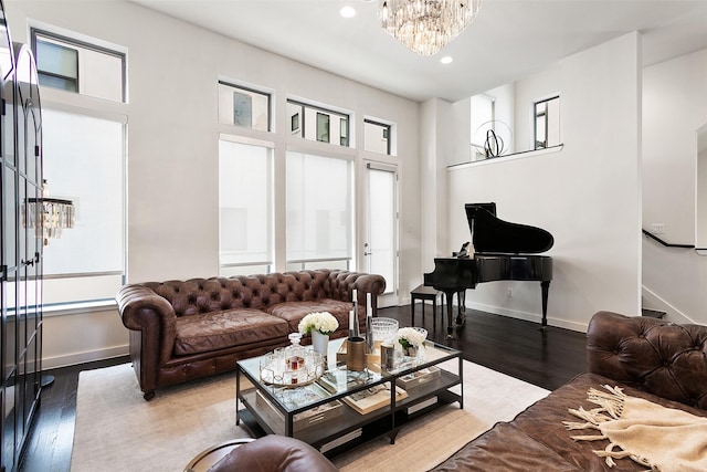 living room with a chandelier and hardwood / wood-style floors