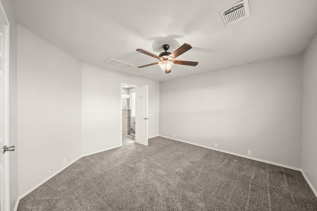 carpeted spare room featuring ceiling fan