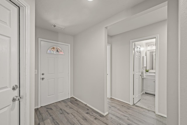 foyer with light wood-type flooring