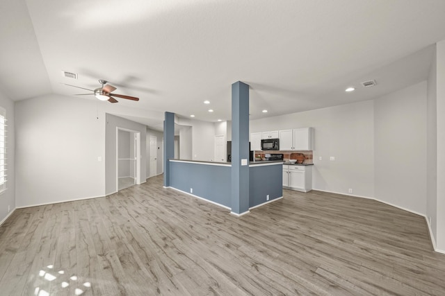 unfurnished living room with ceiling fan, light hardwood / wood-style flooring, and lofted ceiling