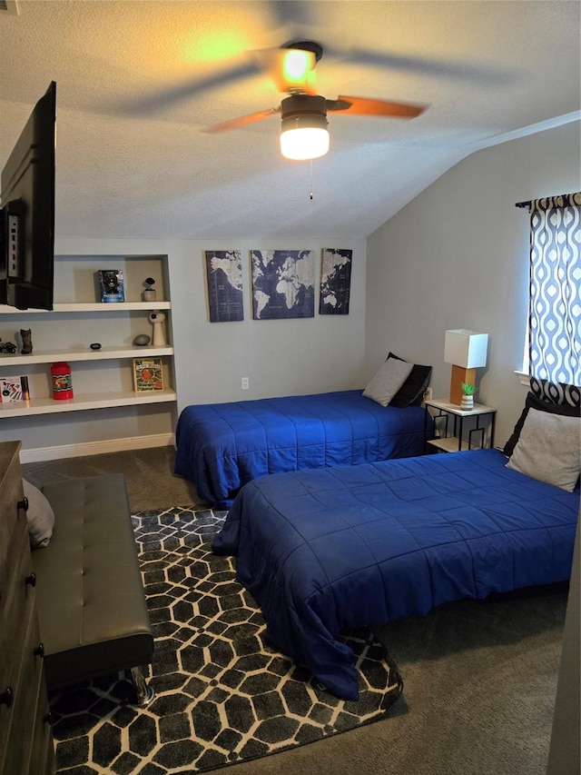 carpeted bedroom featuring ceiling fan, lofted ceiling, and a textured ceiling