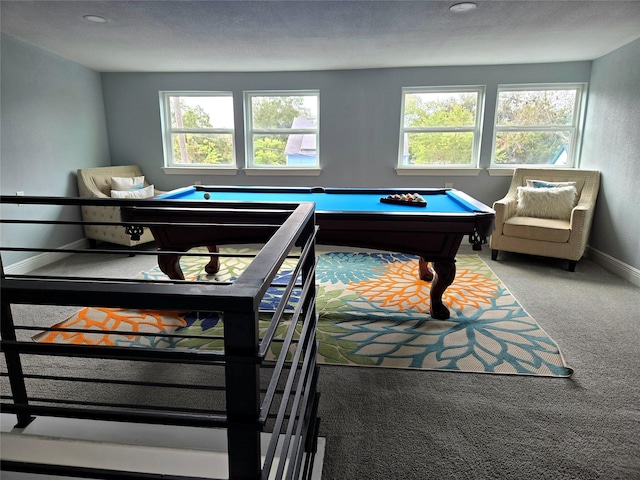 rec room with a textured ceiling, carpet floors, and pool table