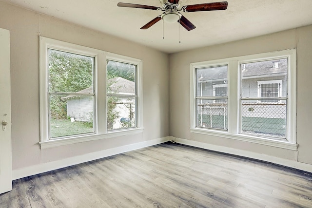 unfurnished room with ceiling fan and light hardwood / wood-style floors