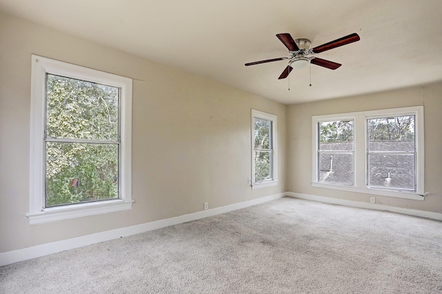 7025 Canal St, Houston, TX 77011 - carpeted empty room featuring baseboards and ceiling fan