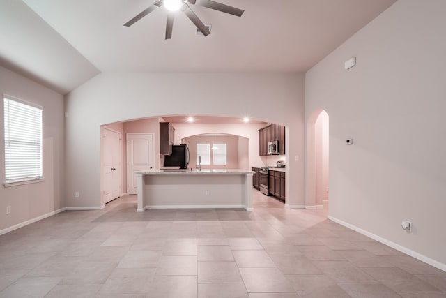 unfurnished living room with ceiling fan, light tile patterned flooring, and lofted ceiling