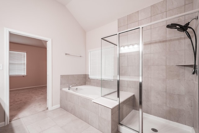 bathroom featuring tile patterned floors, independent shower and bath, and lofted ceiling