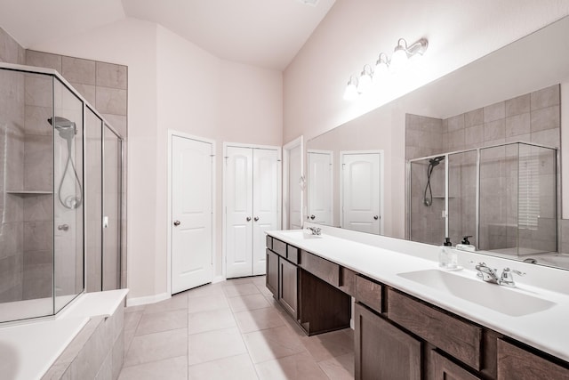 bathroom featuring tile patterned flooring, vanity, shower with separate bathtub, and high vaulted ceiling