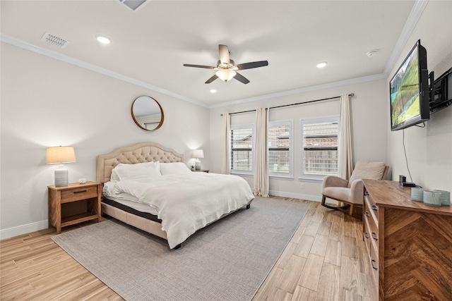 bedroom with ceiling fan, crown molding, and light hardwood / wood-style floors