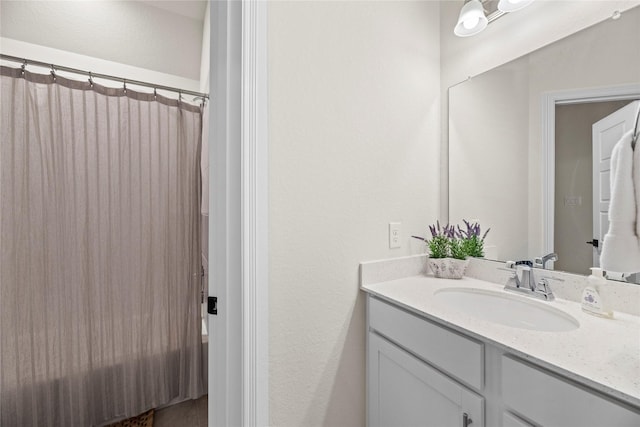 bathroom featuring vanity and a shower with shower curtain