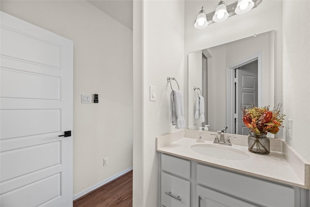 bathroom with vanity and hardwood / wood-style flooring