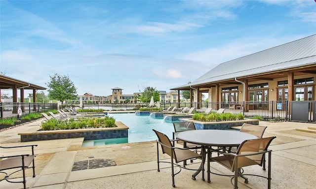 view of pool featuring a patio