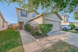 view of front property with a front yard and a garage