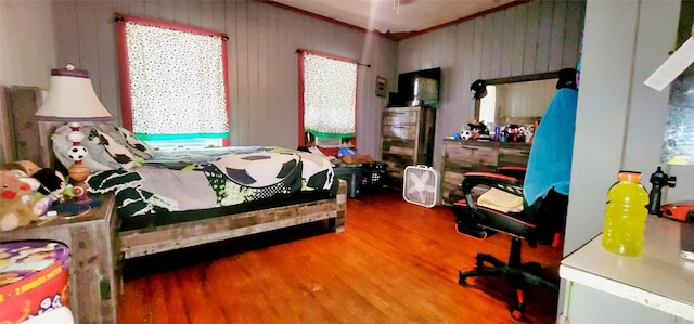 bedroom with wood-type flooring