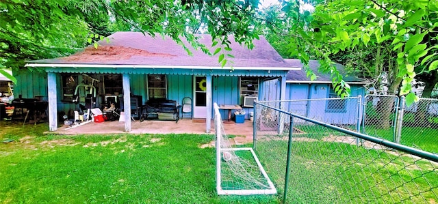 back of house featuring a yard and cooling unit