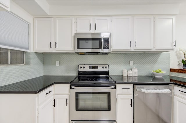 kitchen with white cabinetry, backsplash, and appliances with stainless steel finishes