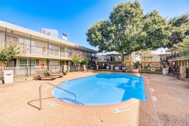 view of swimming pool with a patio