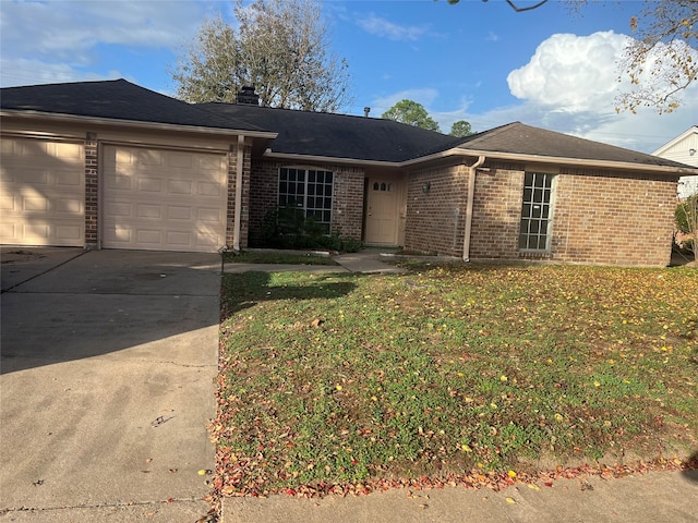 single story home featuring a garage and a front yard