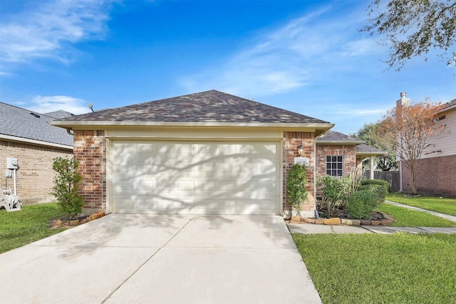 ranch-style home with a front yard and a garage