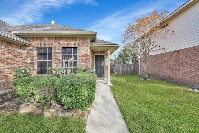 property entrance with a yard