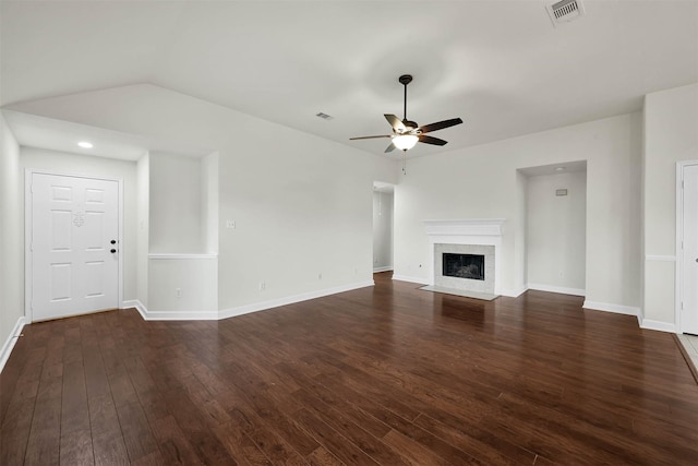 unfurnished living room with dark hardwood / wood-style floors and ceiling fan