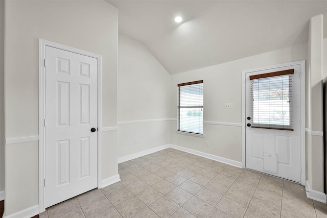 interior space featuring plenty of natural light and lofted ceiling