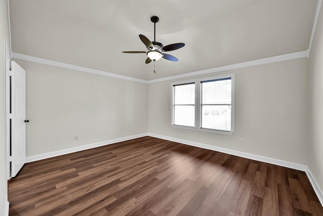 empty room with dark hardwood / wood-style floors, ceiling fan, and crown molding