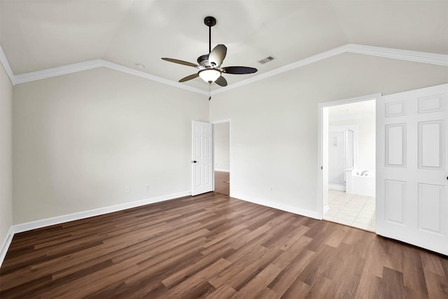 unfurnished bedroom featuring lofted ceiling, hardwood / wood-style flooring, ceiling fan, and crown molding