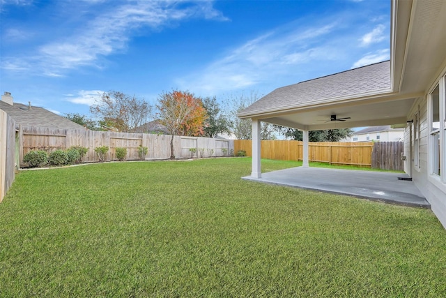 view of yard featuring a patio and ceiling fan