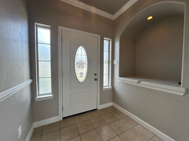 tiled entryway with crown molding