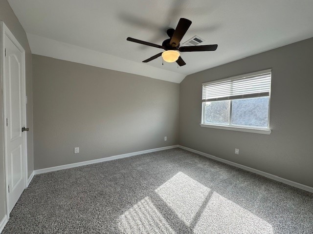 unfurnished room featuring carpet, ceiling fan, and lofted ceiling