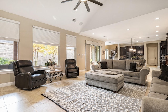 living room featuring light tile patterned floors, ceiling fan with notable chandelier, and high vaulted ceiling