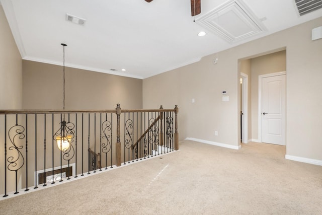 hallway featuring crown molding and carpet