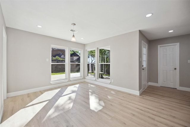 spare room featuring light wood-type flooring