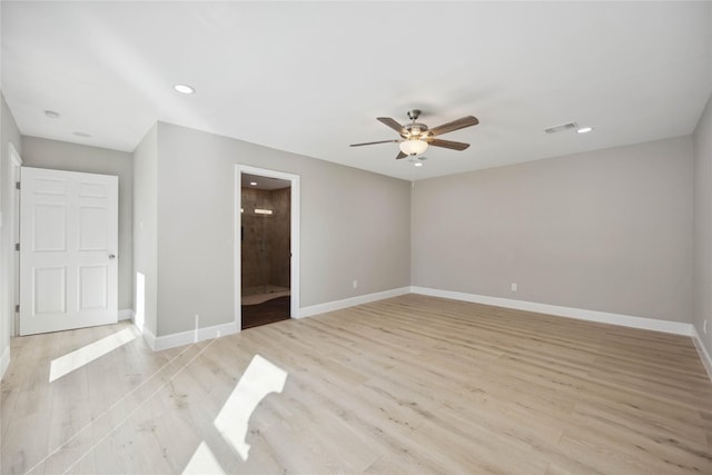 unfurnished room with ceiling fan and light wood-type flooring