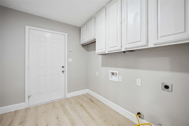 washroom featuring cabinets, washer hookup, light wood-type flooring, and electric dryer hookup