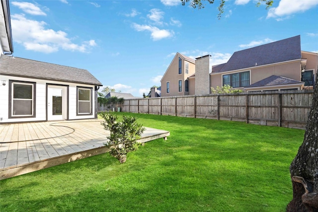 view of yard with a wooden deck