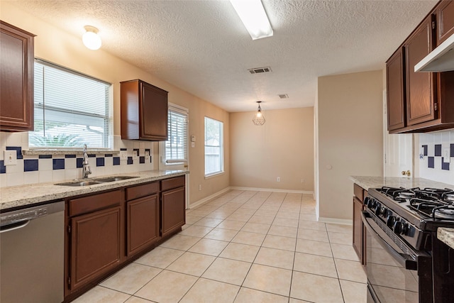 kitchen with tasteful backsplash, stainless steel dishwasher, black gas range oven, exhaust hood, and sink