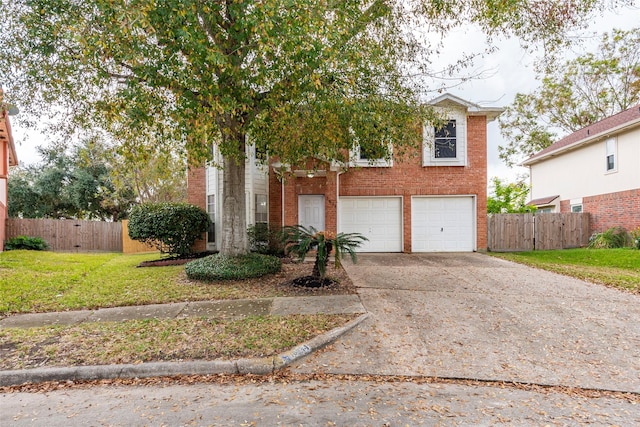 view of front of house featuring a garage and a front lawn