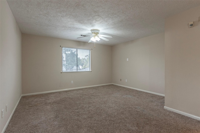 empty room featuring carpet floors and a textured ceiling