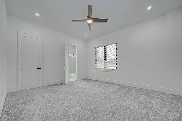 unfurnished bedroom with ceiling fan and light colored carpet