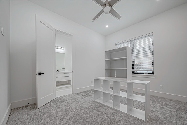 interior space featuring carpet flooring and ceiling fan