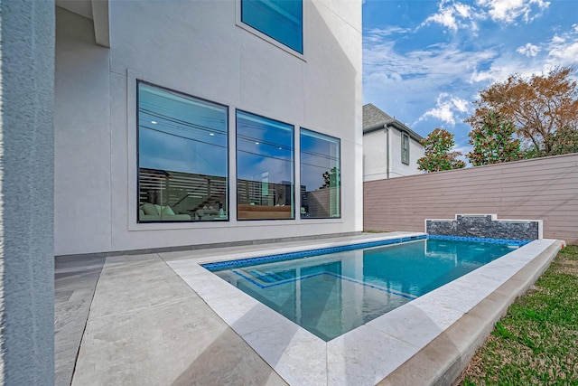 view of pool featuring a patio area and a jacuzzi