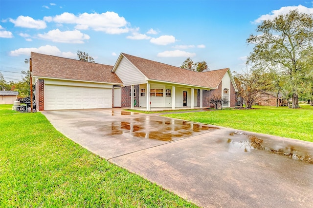 view of front of home with a front yard, a porch, and a garage