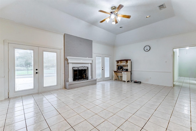 unfurnished living room with ceiling fan, french doors, and light tile patterned floors