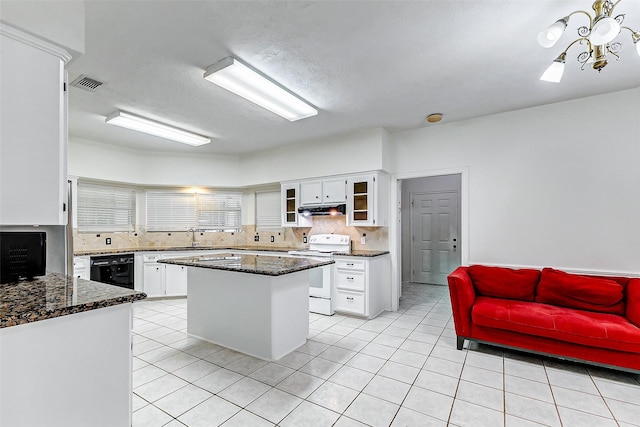 kitchen with a center island, sink, white electric range oven, backsplash, and white cabinets